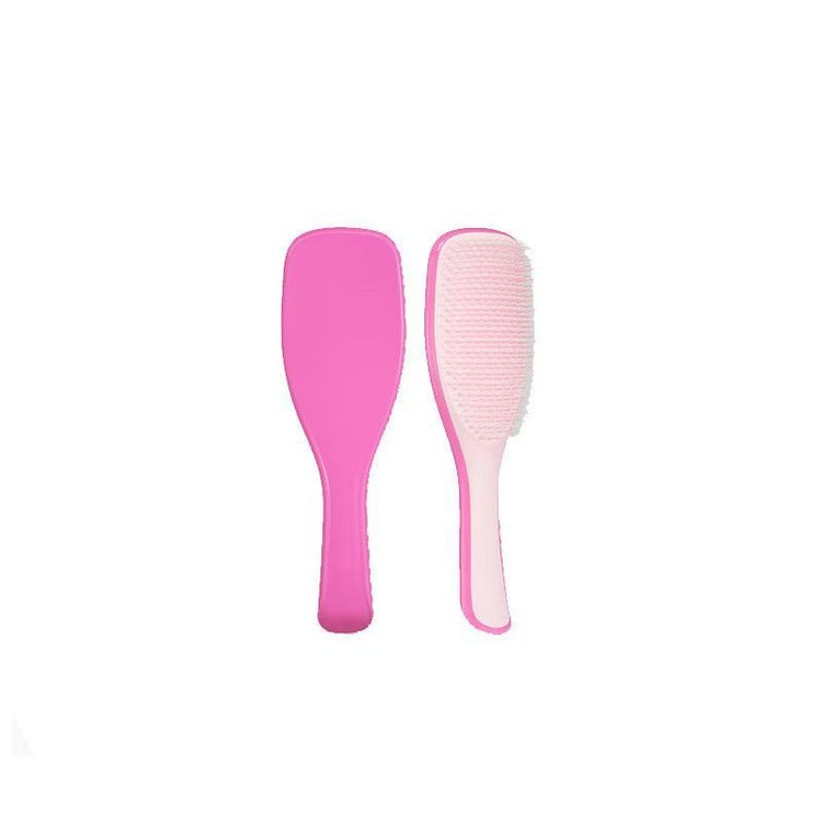 Hot pink Knotty Brush detangling hair brushes on a white background