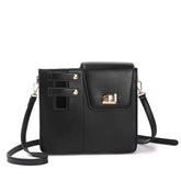 Black STAN Sack crossbody bag with lock buckle closure and adjustable shoulder strap, front view