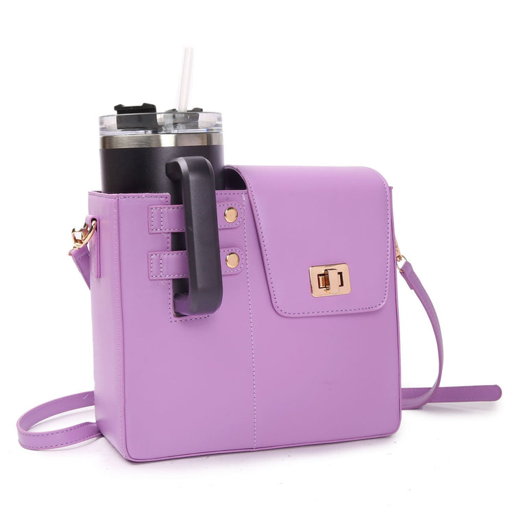 Purple STAN Sack crossbody bag with side cup holder holding a tumbler, front view