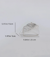 A silver metallic clutch bag with a curved, shell-like silhouette and chain strap, shown on a light gray background with dimension lines and measurements indicating 5.91 in height, 1.