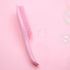 Pink Knotty Brush detangling hair brush with soft pink bristles on a pink background