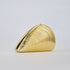 Gold ribbed shell acrylic clutch purse, side view on a light gray background