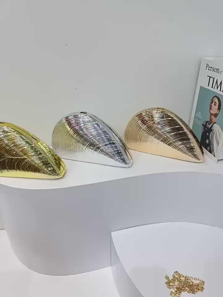 Video showcasing gold acrylic clutch collection including multiple color variations on white surface